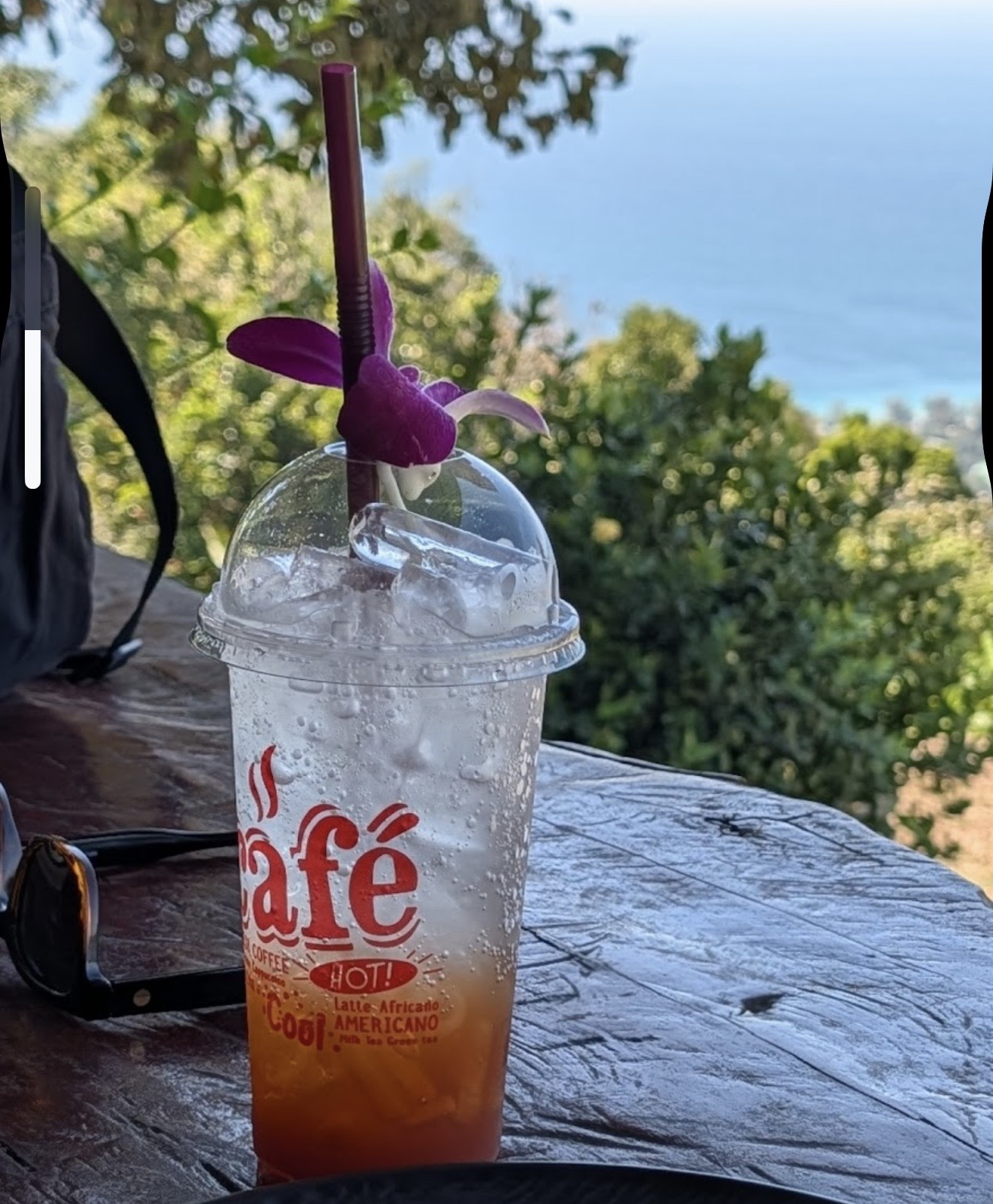Iced soda drink with sea view